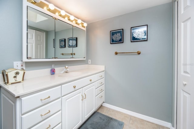 bathroom featuring tile patterned flooring and vanity