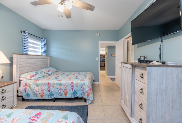 tiled bedroom with ceiling fan