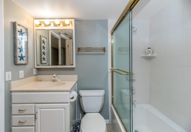 full bathroom featuring vanity, toilet, and combined bath / shower with glass door