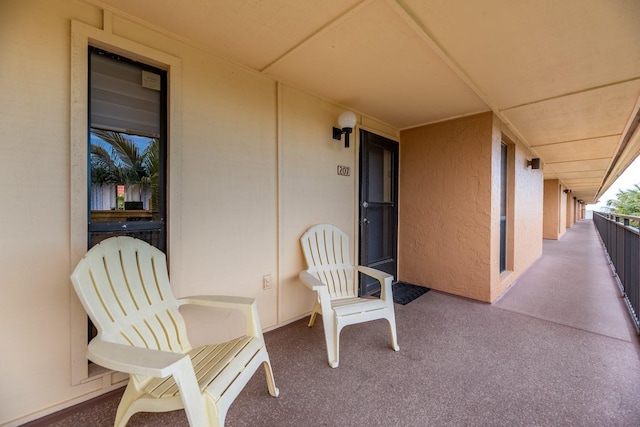 view of patio featuring a balcony