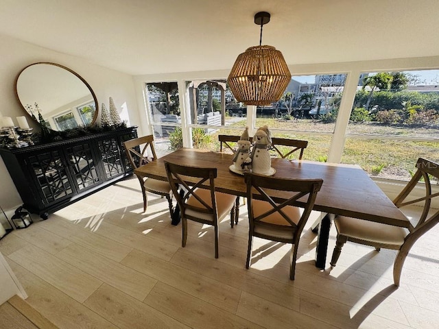 dining room featuring a wealth of natural light and light wood-type flooring