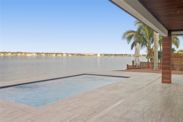 view of pool with a water view