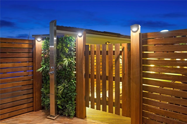 view of gate at dusk