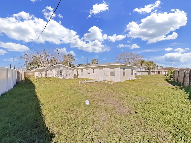 back of house with a yard