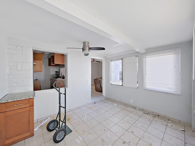 interior space with ceiling fan