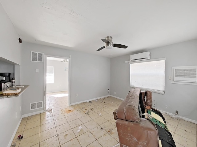 tiled living room featuring ceiling fan and a wall mounted AC