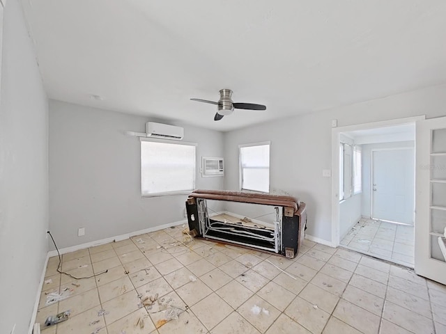 unfurnished bedroom featuring ceiling fan and a wall mounted air conditioner