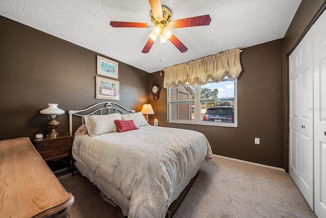 bedroom featuring a textured ceiling, a closet, and ceiling fan