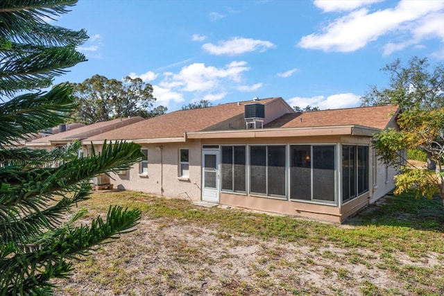 back of house with a sunroom