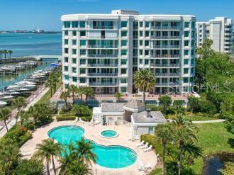 view of swimming pool featuring a patio area and a water view