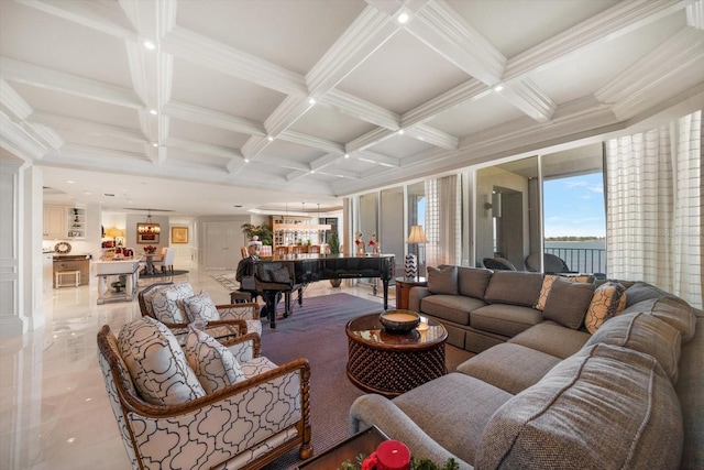 living room featuring beam ceiling, crown molding, coffered ceiling, and a notable chandelier