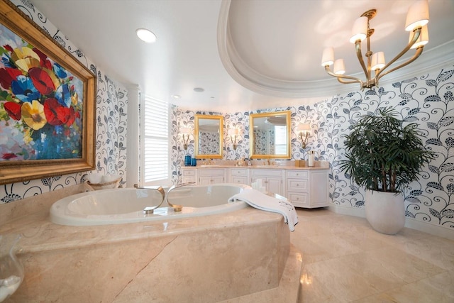 bathroom featuring a relaxing tiled tub, vanity, and an inviting chandelier