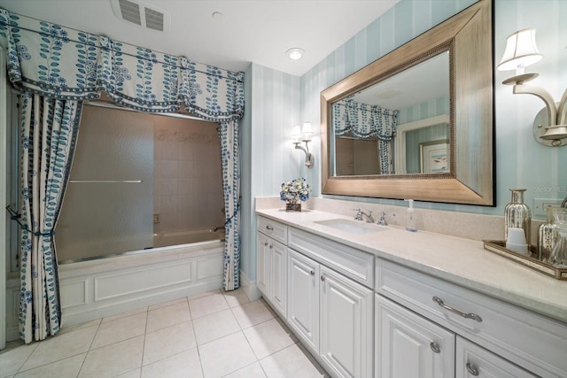 bathroom featuring tile patterned floors, vanity, and shower / tub combo