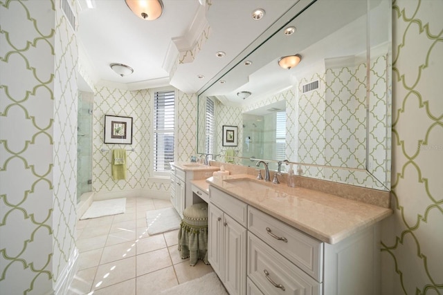 bathroom featuring tile patterned floors, vanity, an enclosed shower, and ornamental molding