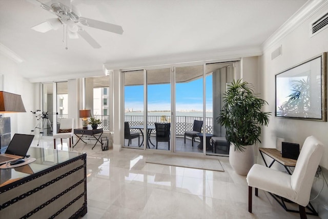 living room featuring ceiling fan, floor to ceiling windows, and ornamental molding