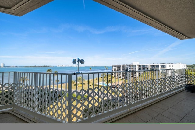 balcony with a view of the beach and a water view