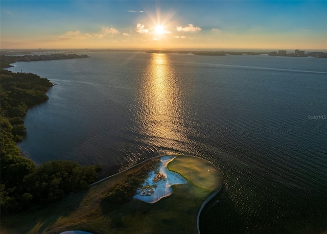 aerial view at dusk with a water view