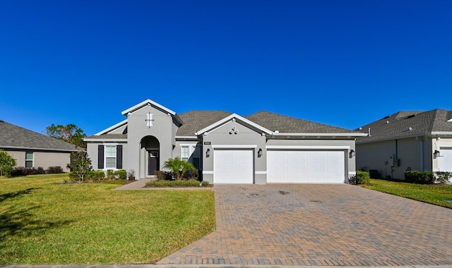 ranch-style home featuring a front yard and a garage