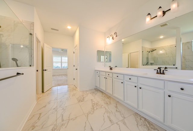 bathroom with vanity, ceiling fan, and a shower with shower door