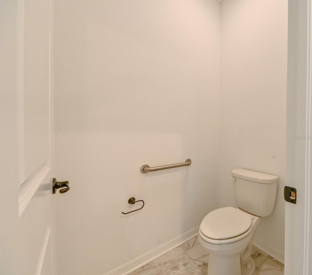 bathroom featuring toilet