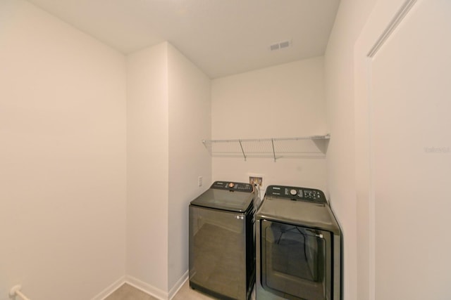 laundry room featuring independent washer and dryer