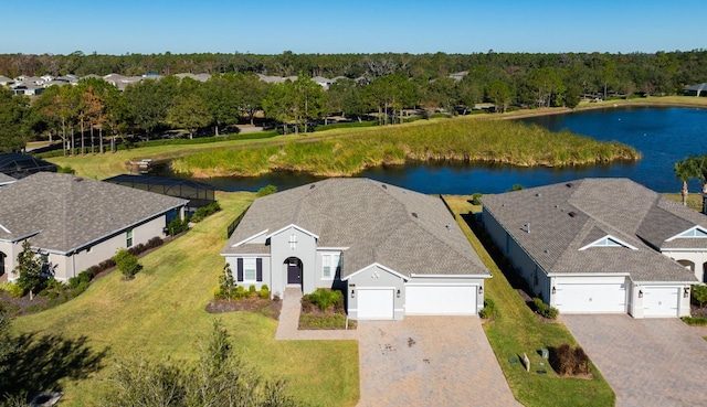 birds eye view of property with a water view