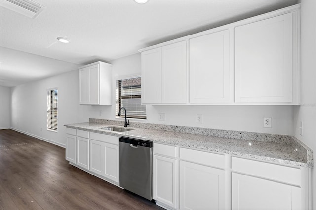 kitchen with white cabinetry, sink, light stone counters, stainless steel dishwasher, and dark hardwood / wood-style floors