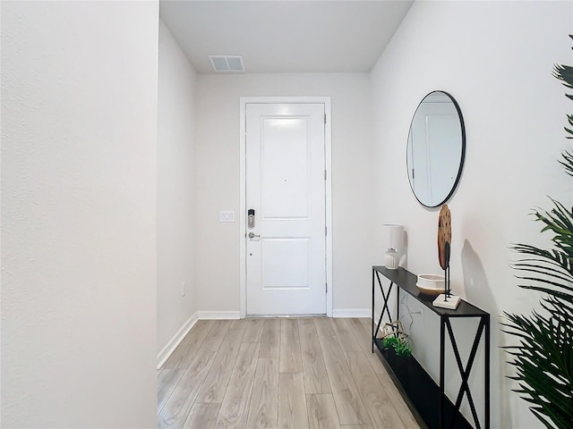 doorway to outside with light hardwood / wood-style flooring