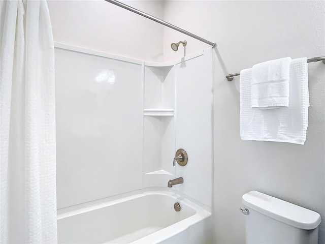 bathroom with toilet and shower / bathtub combination with curtain