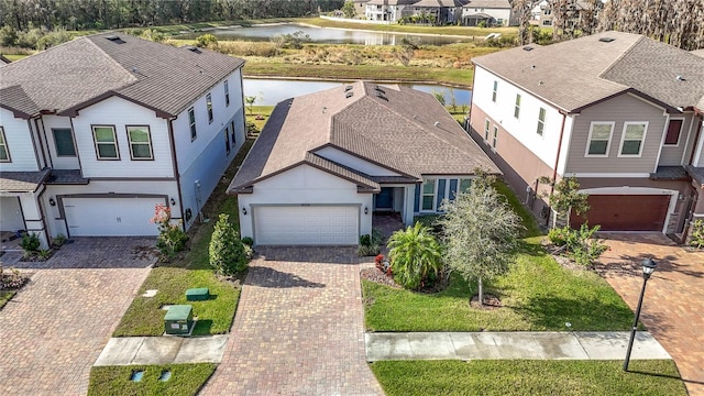 birds eye view of property with a water view