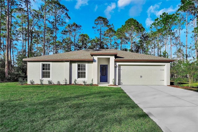 view of front of property with a front yard and a garage