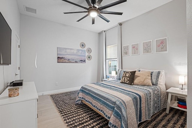 bedroom featuring ceiling fan and light hardwood / wood-style flooring