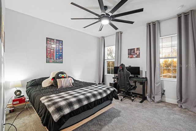 carpeted bedroom featuring ceiling fan