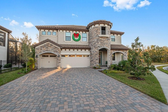 mediterranean / spanish house featuring a garage