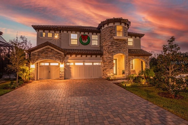 mediterranean / spanish house featuring a garage