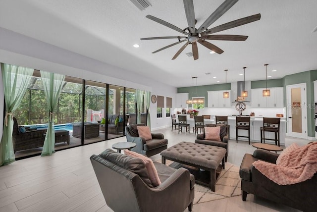 13019 Paddock Wood Pl, Riverview, FL 33579 - living room featuring ceiling fan, recessed lighting, and light wood finished floors
