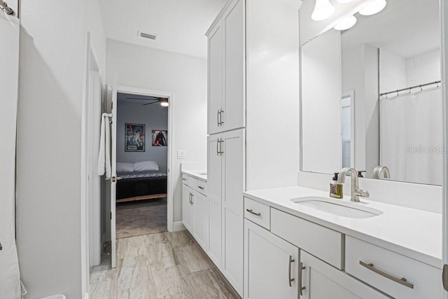 13019 Paddock Wood Pl, Riverview, FL 33579 - ensuite bathroom with vanity, a ceiling fan, marble look tiles, and a shower with curtain