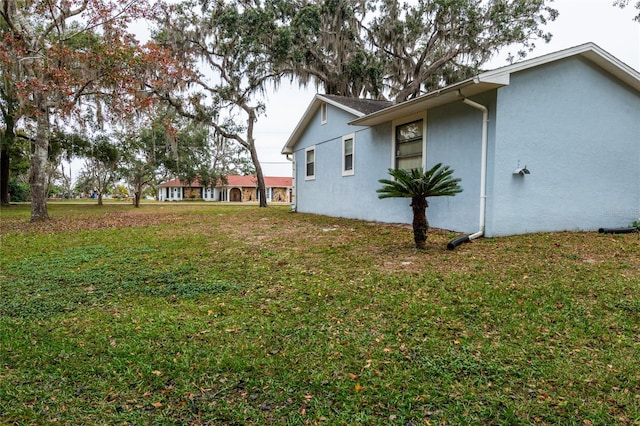 view of home's exterior featuring a yard