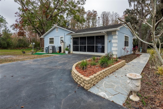 single story home featuring cooling unit