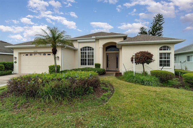 view of front facade featuring a garage and a front yard