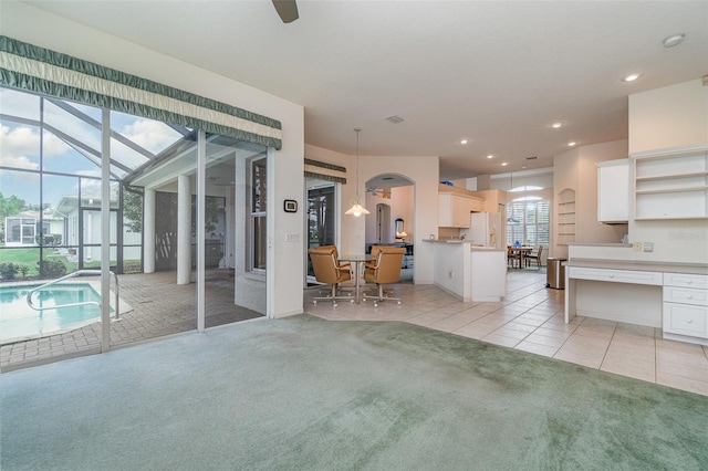 unfurnished living room with light carpet