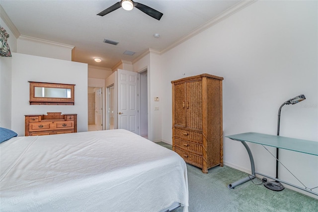 bedroom with ceiling fan, carpet floors, and ornamental molding