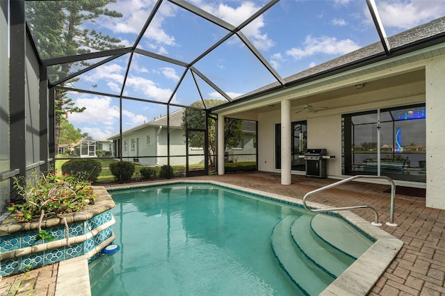 view of pool featuring ceiling fan, area for grilling, a lanai, and a patio