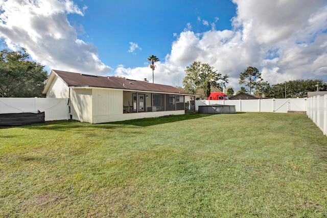 view of yard with a sunroom