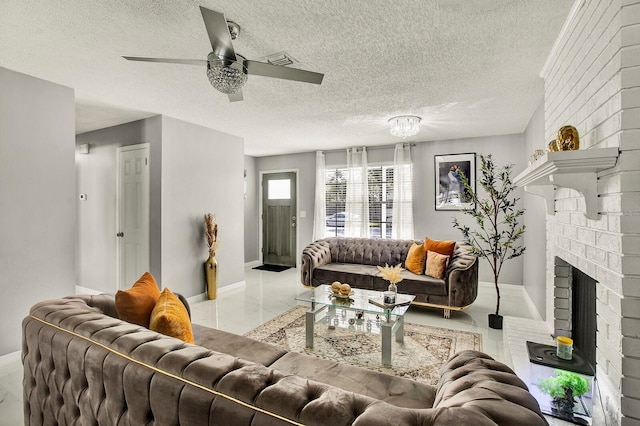 living room featuring a fireplace, light tile patterned floors, a textured ceiling, and ceiling fan