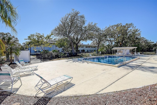 view of swimming pool with a patio area