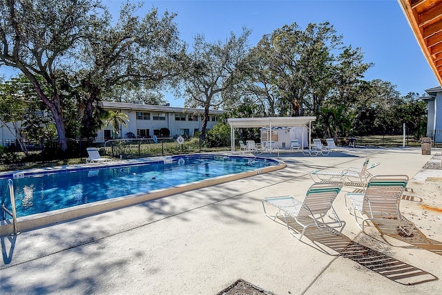 view of swimming pool with a patio