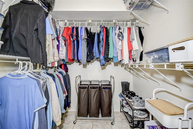 spacious closet featuring tile patterned floors