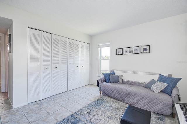 living room with light tile patterned floors and a textured ceiling