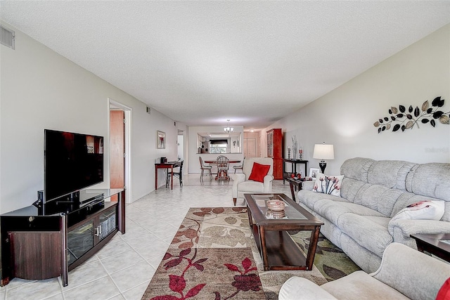 tiled living room with a textured ceiling